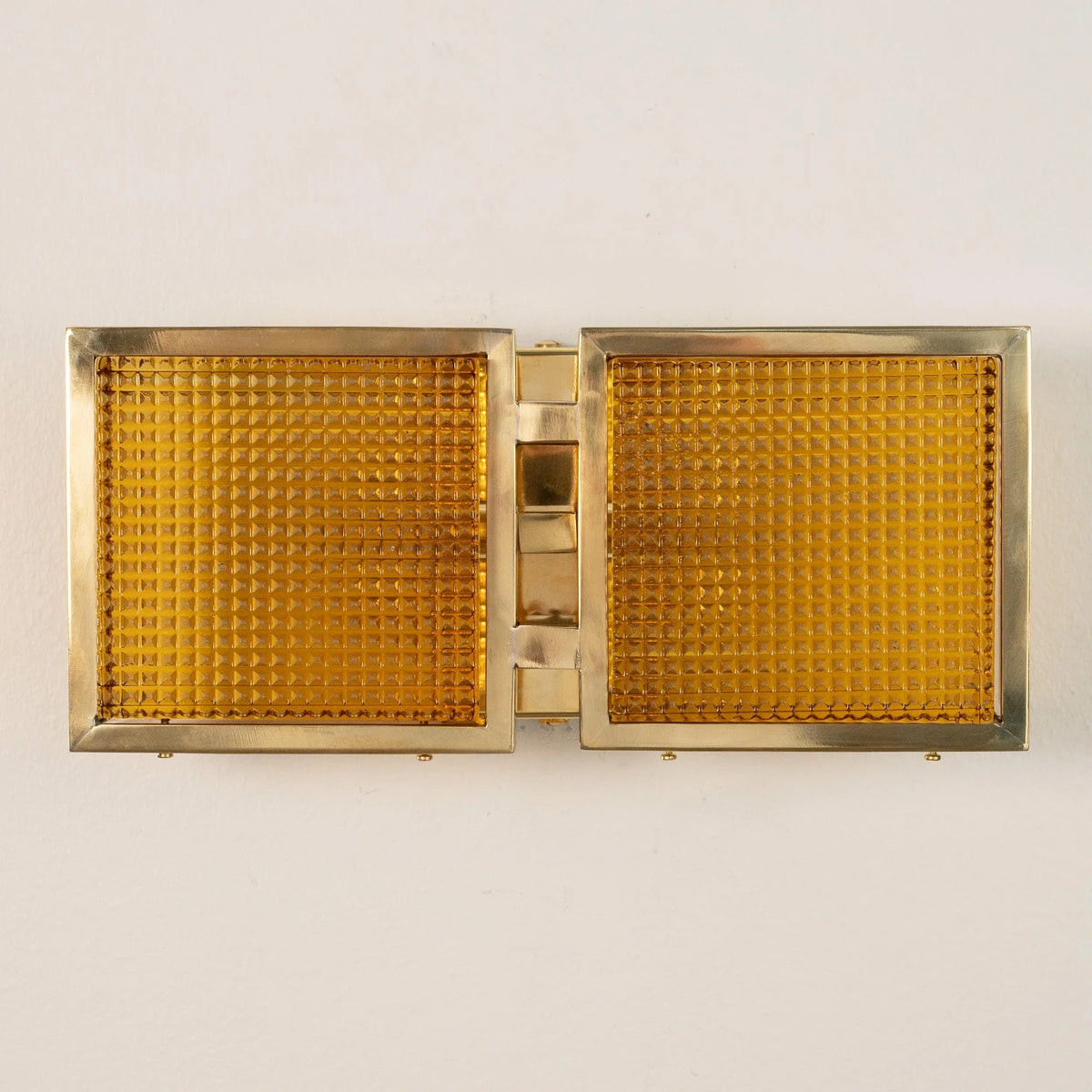 Amber Murano glass brick wall sconce mounted horizontally, unlit, front view