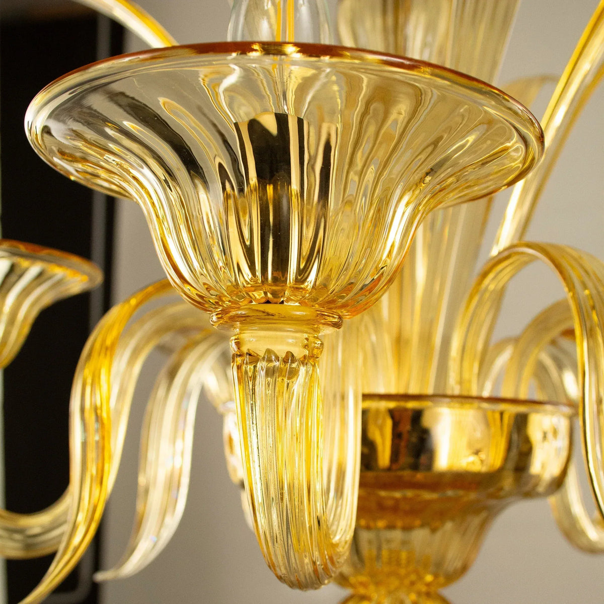 Amber Murano glass five-arm chandelier — flared glass lamp cup detail