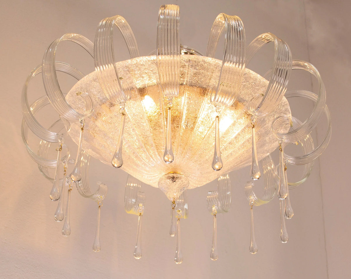 Clear Murano glass chandelier with leaves and drops — illuminated glass bowl and drops
