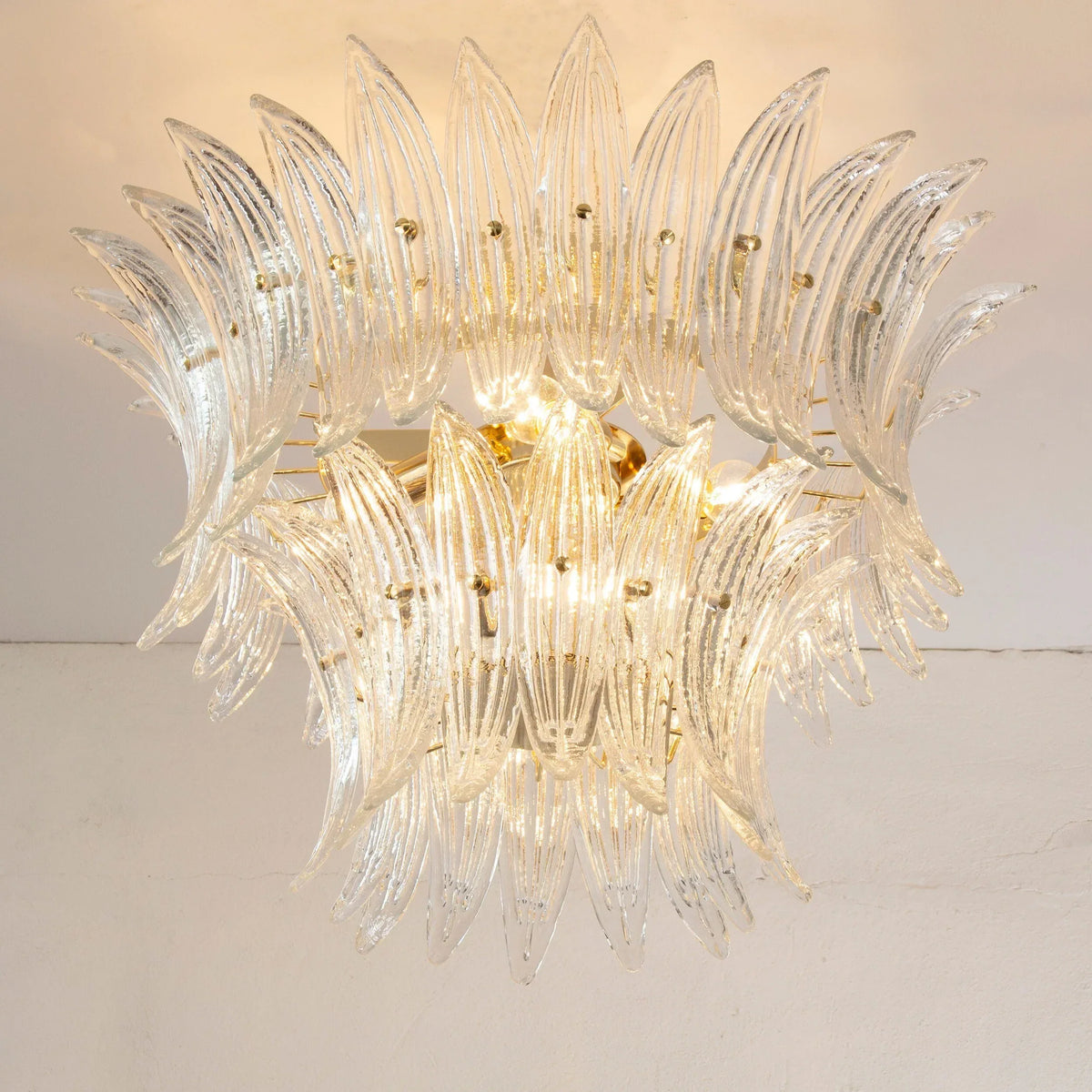 Clear Murano glass leaf ceiling lamp — illuminated underside