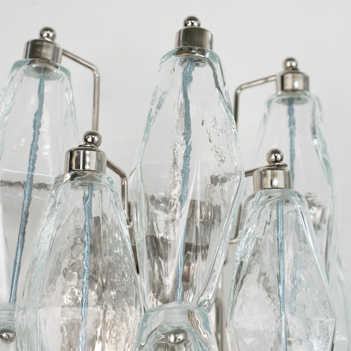 Close-up of unlit clear Murano glass Poliedri elements with nickel caps