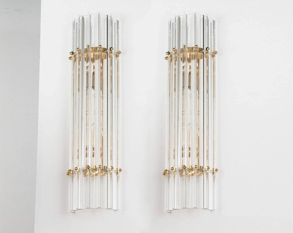 Pair of tall clear Murano glass Triedri wall sconces with brass rings, front view