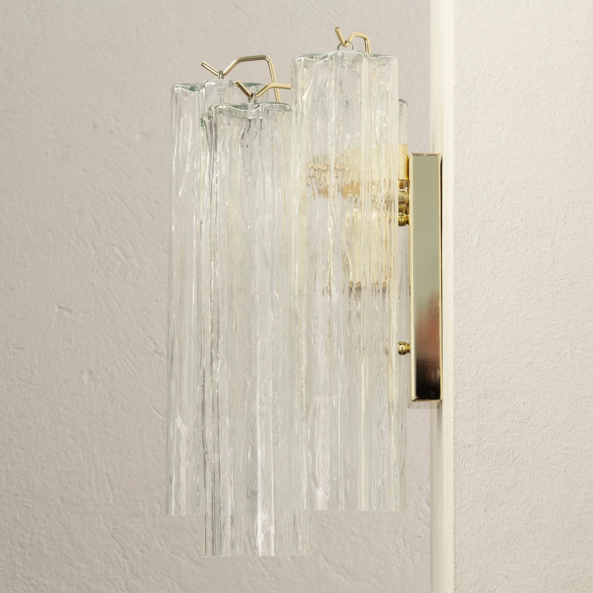 Clear Tronchi Murano glass wall sconce — side view with wall plate