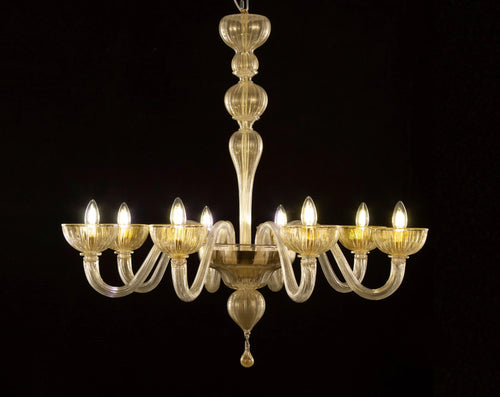 Gold-toned Murano glass eight-arm chandelier — illuminated full view