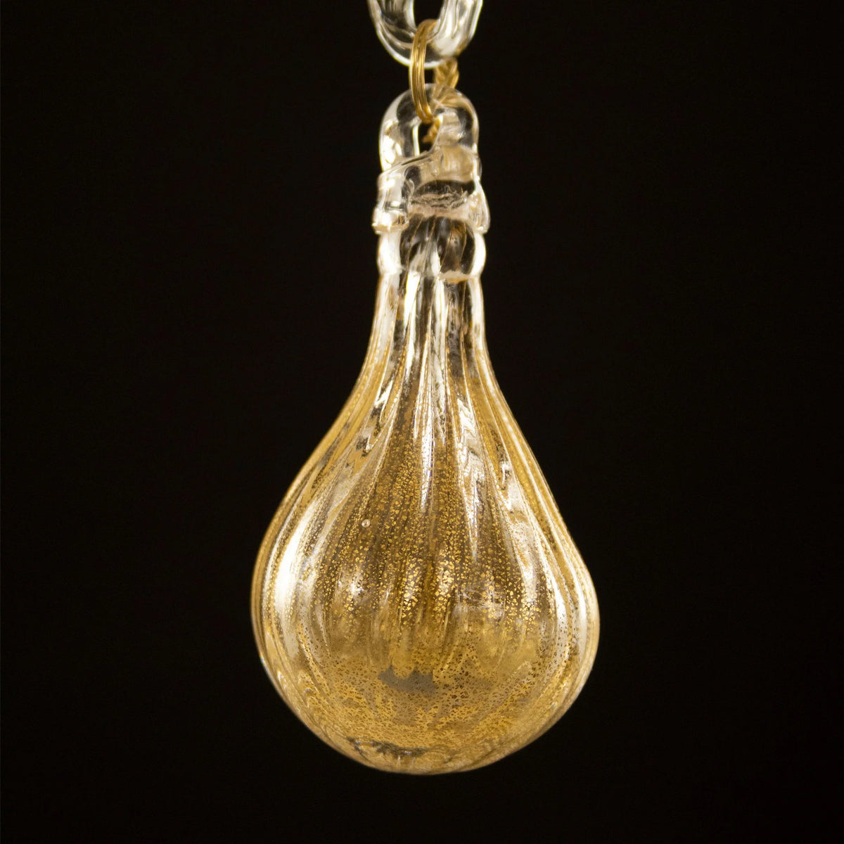 Gold-toned Murano glass eight-arm chandelier — hanging glass drop close-up