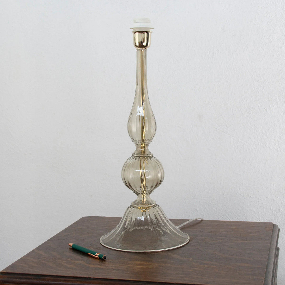Grey Murano glass table lamp base — single base beside a lighter for scale