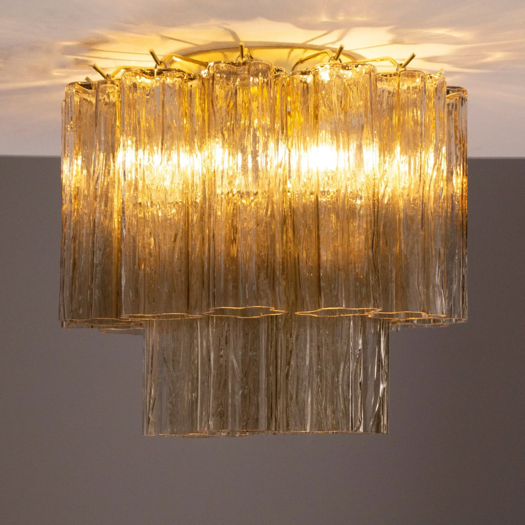 Illuminated Tronchi Murano glass ceiling light viewed from the side