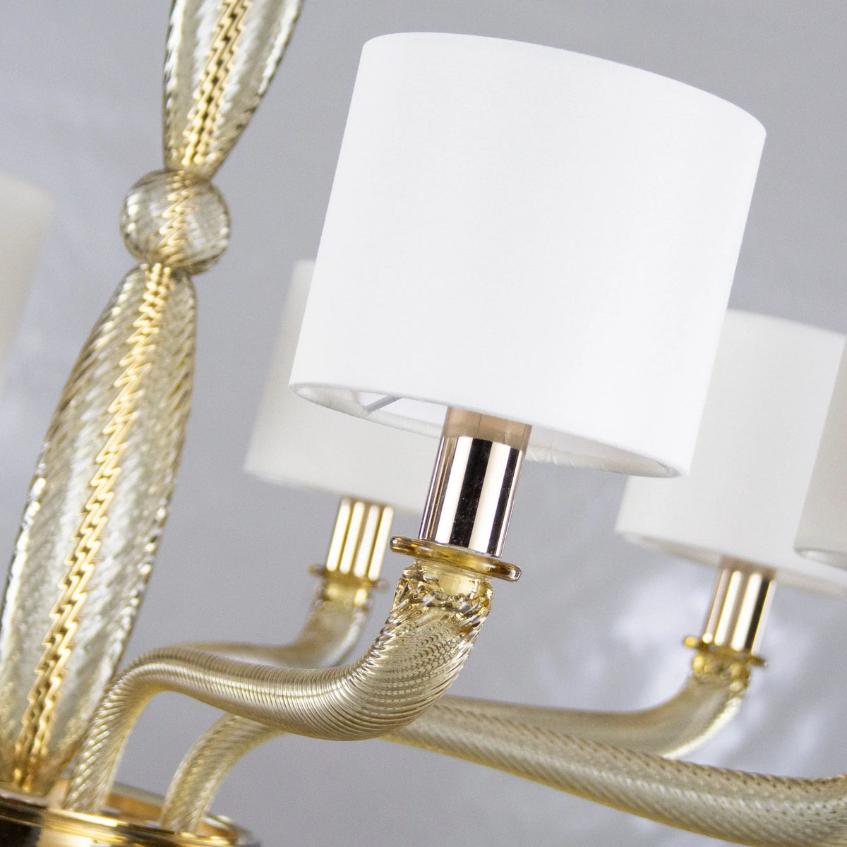 Large Murano glass chandelier with ivory lampshades — glass stem and arm detail