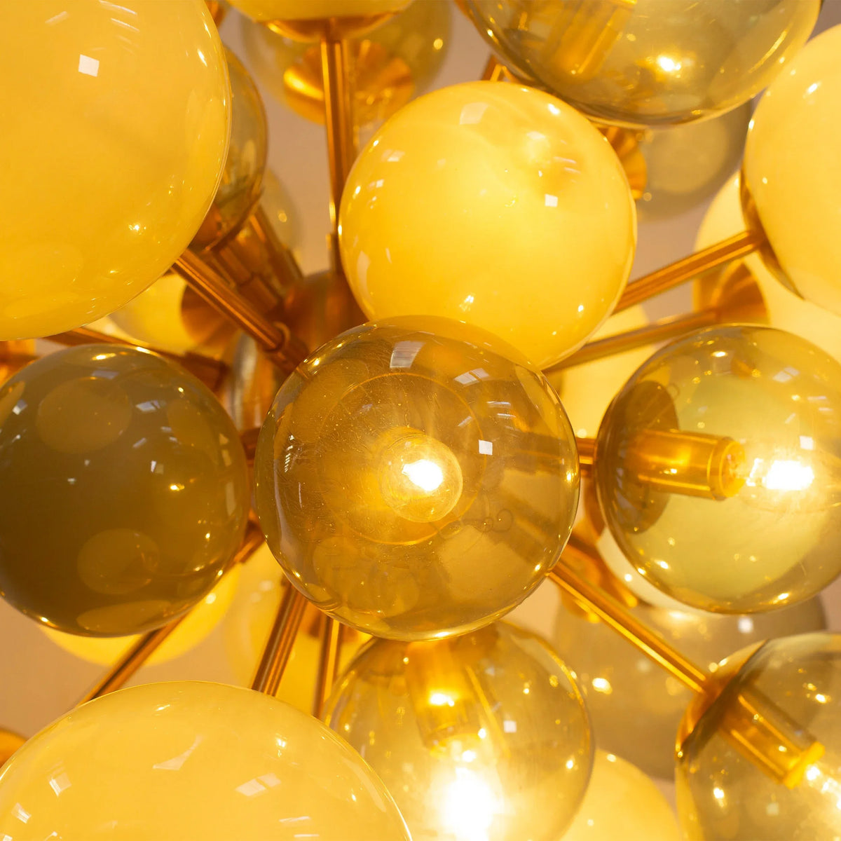 Murano glass sphere chandelier — illuminated, angled view