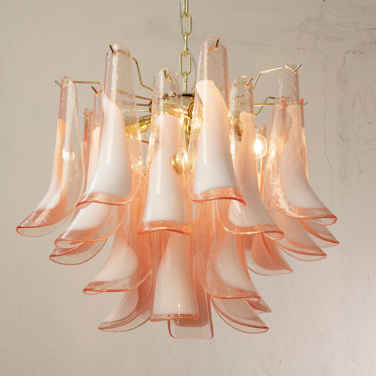 Petali Murano glass chandelier — pink glass version illuminated