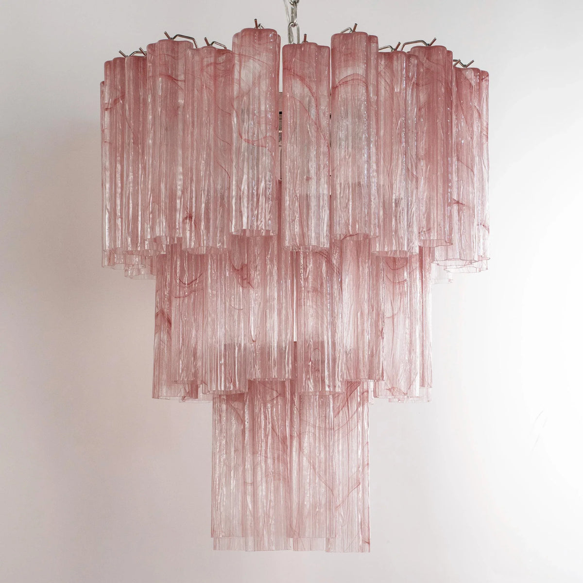 Pink Tronchi Murano glass chandelier — unlit, angled view