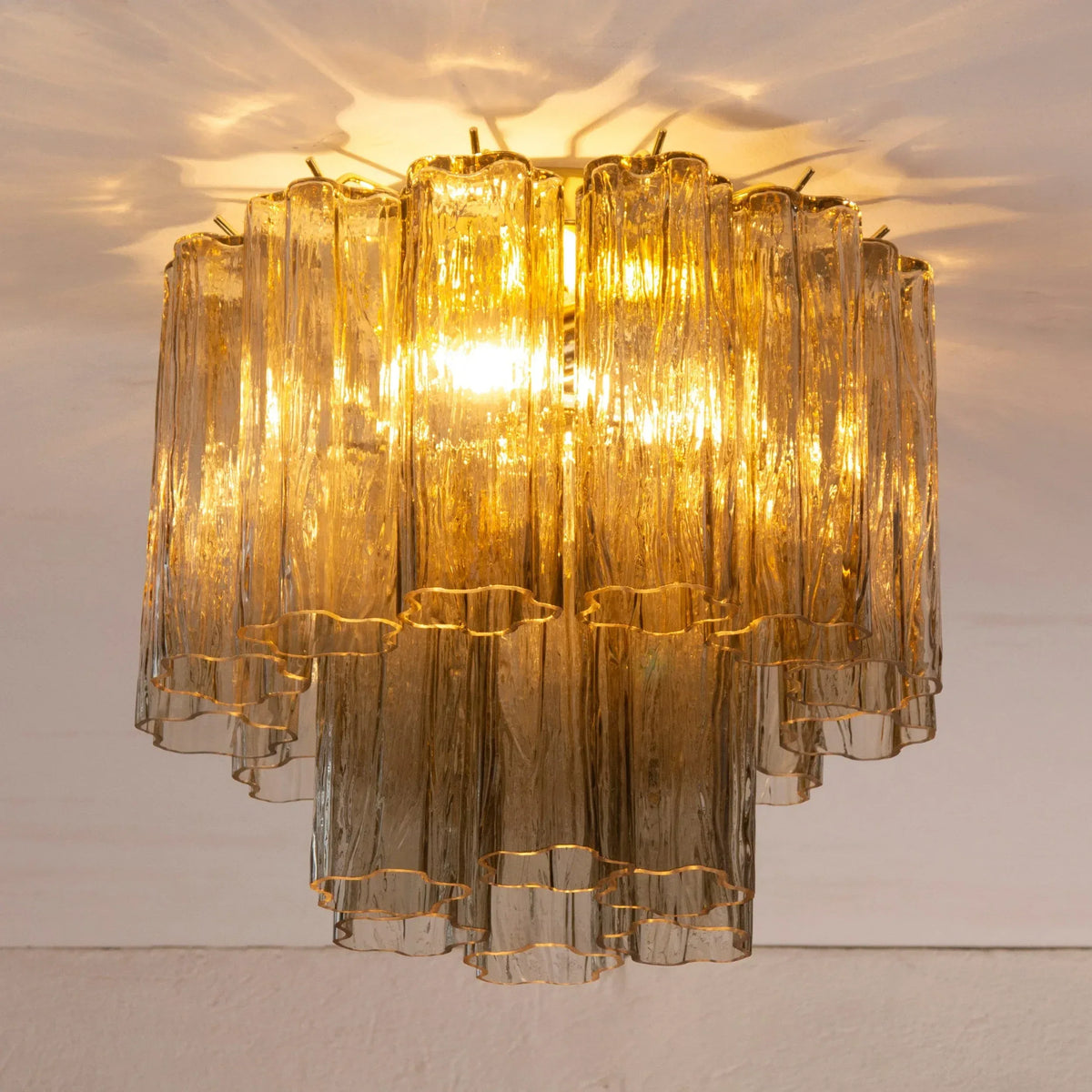 Tronchi Murano glass ceiling light illuminated, full view